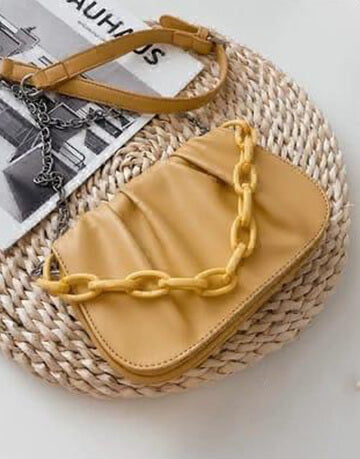 Yellow Sling Bag With Acrylic Accessories